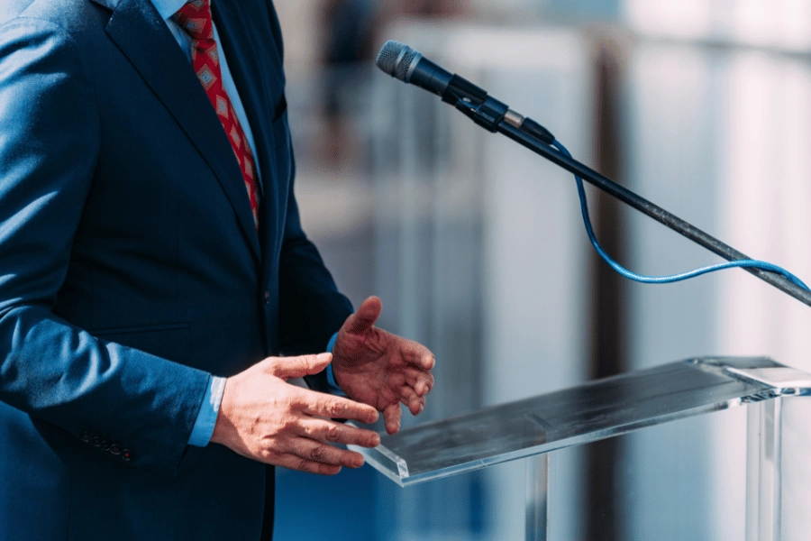 Man in suit at lectern