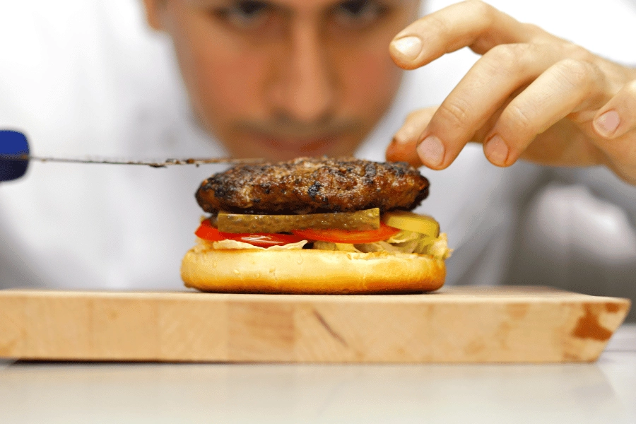 Chef preparing a burger