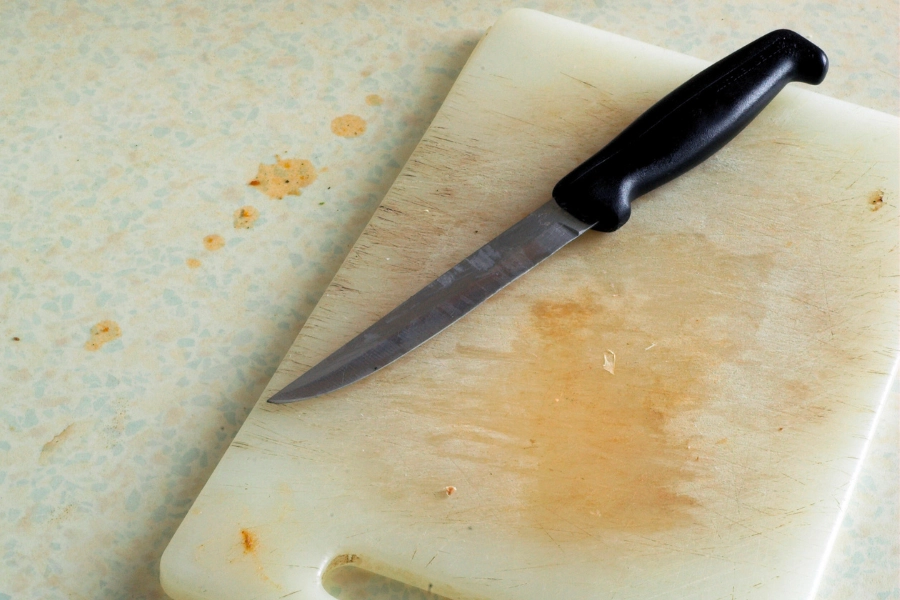 Dirty knife and chopping board