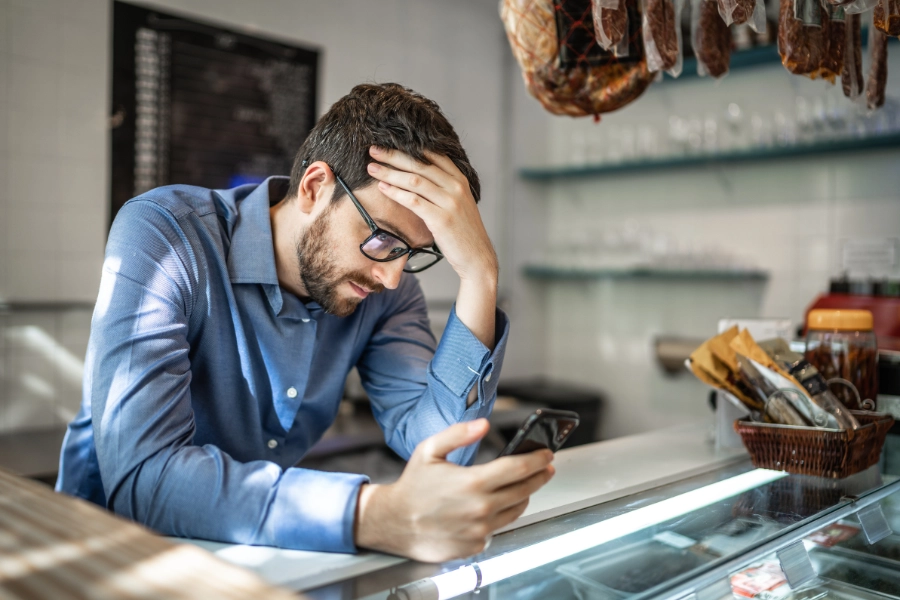 Business owner receiving bad news